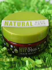 Hip Peas jar on wood table in a family-ready bathroom setting, approachable formula