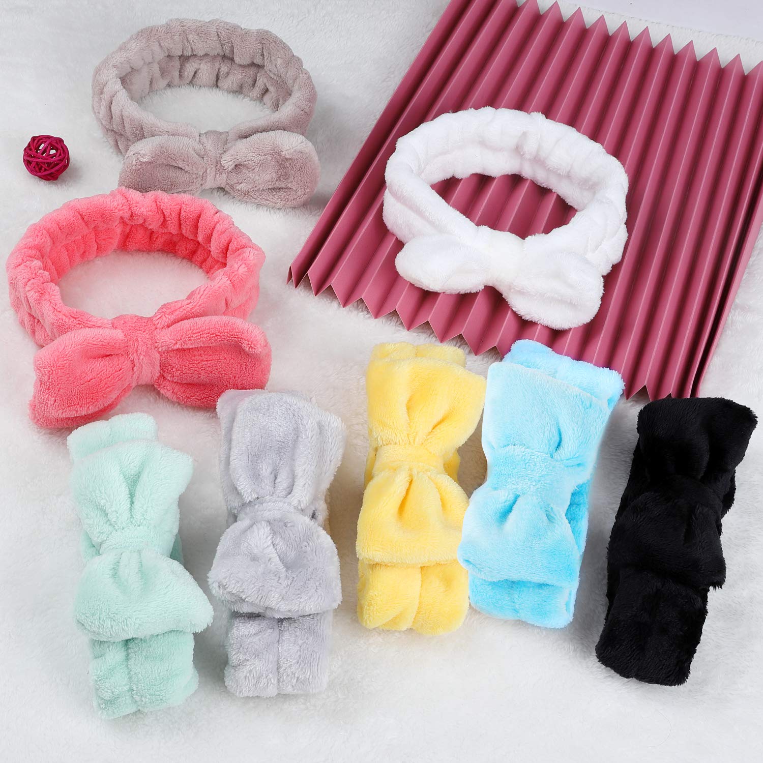 Hishexin hand holding stretched headband to show size, flexible fit benefit