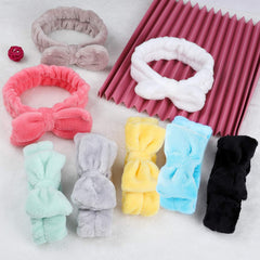 Hishexin hand holding stretched headband to show size, flexible fit benefit