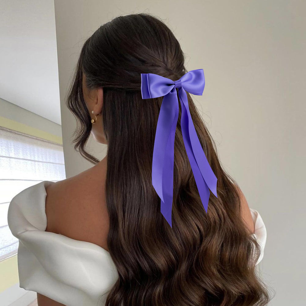 hisial bow worn in a half-up hairstyle for instant polish