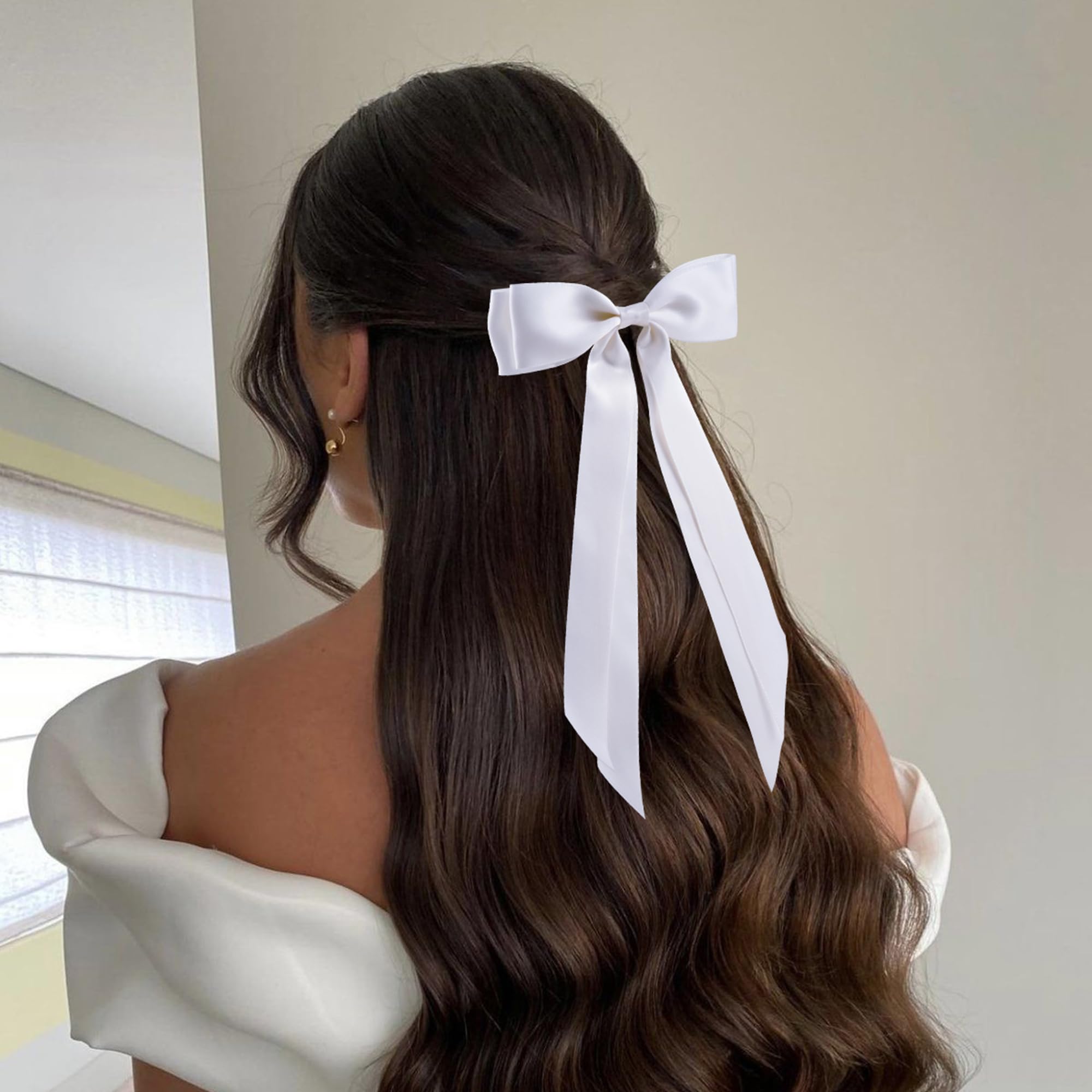 hisial bows worn in a ponytail demonstrating polished look and grip