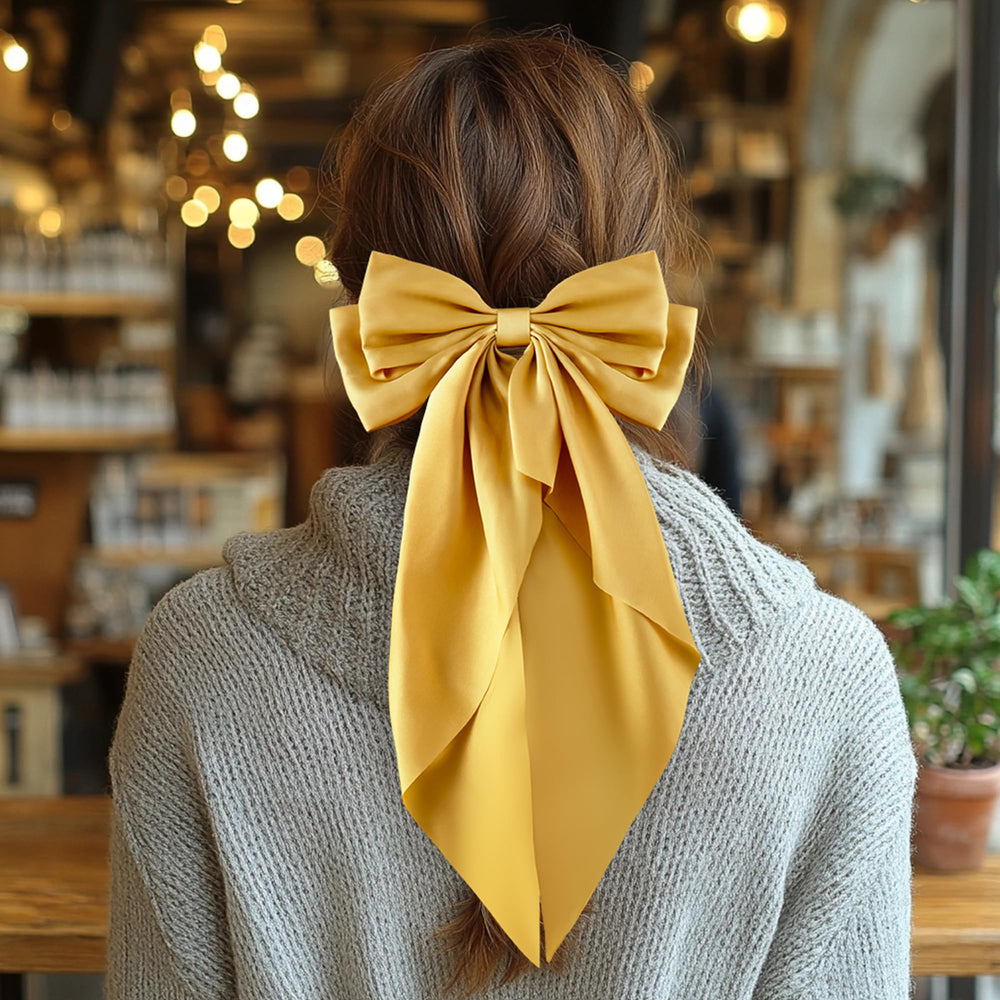 hisial bow worn with a dress in lifestyle shot showing formal styling versatility