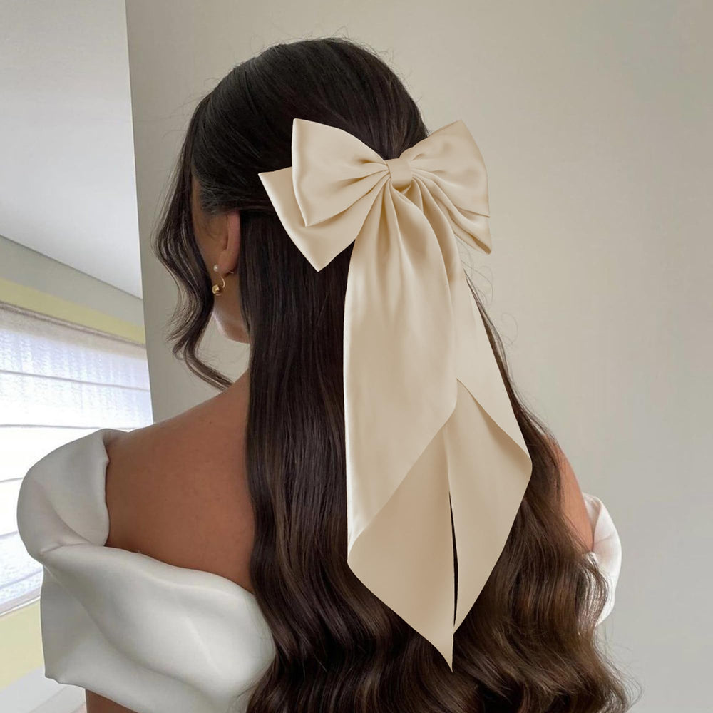 hisial bow clipped into ponytail demonstrating secure hold and elegant silhouette