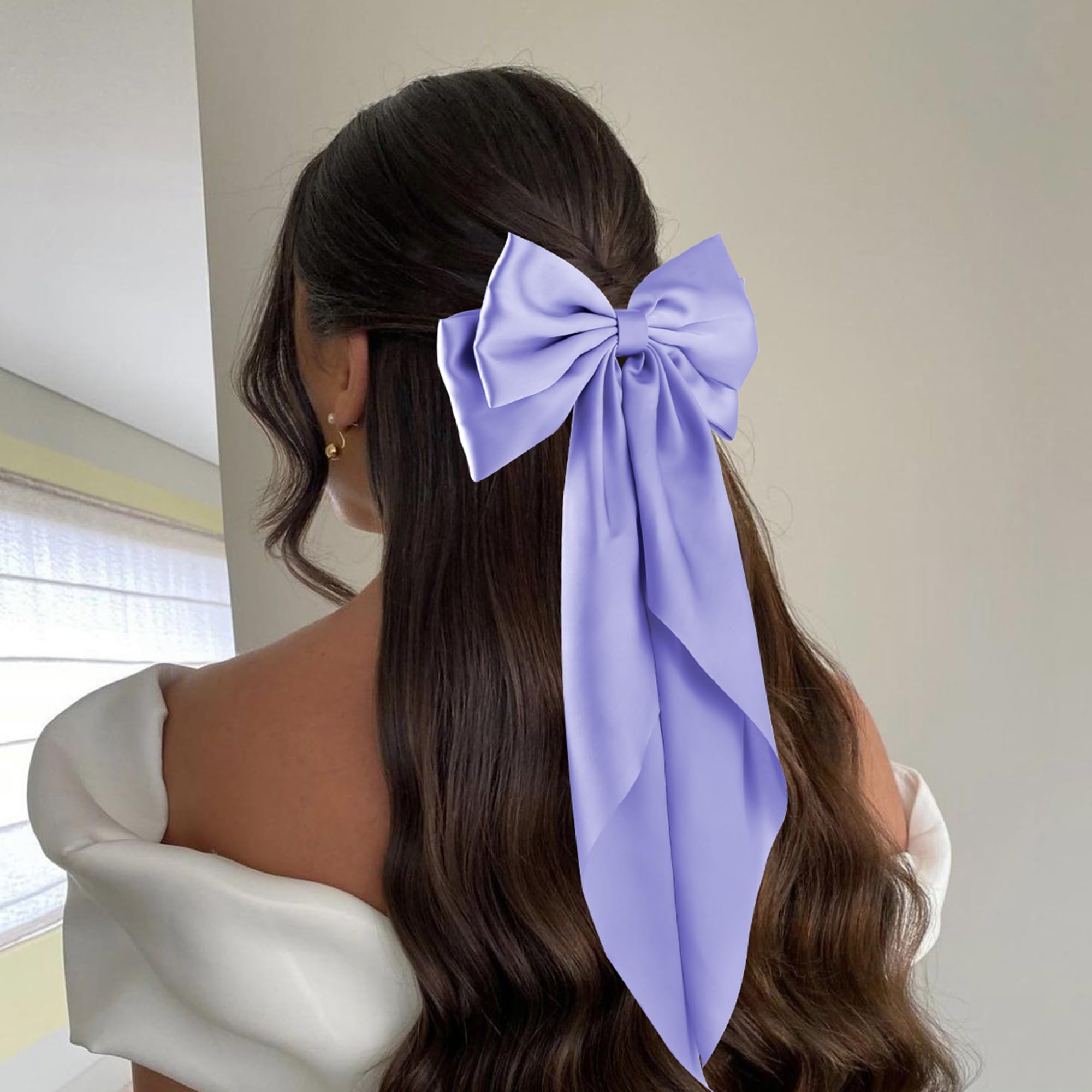 hisial model wearing deepblue bow demonstrating elegant styling and visual impact benefit