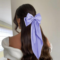 hisial model wearing deepblue bow demonstrating elegant styling and visual impact benefit