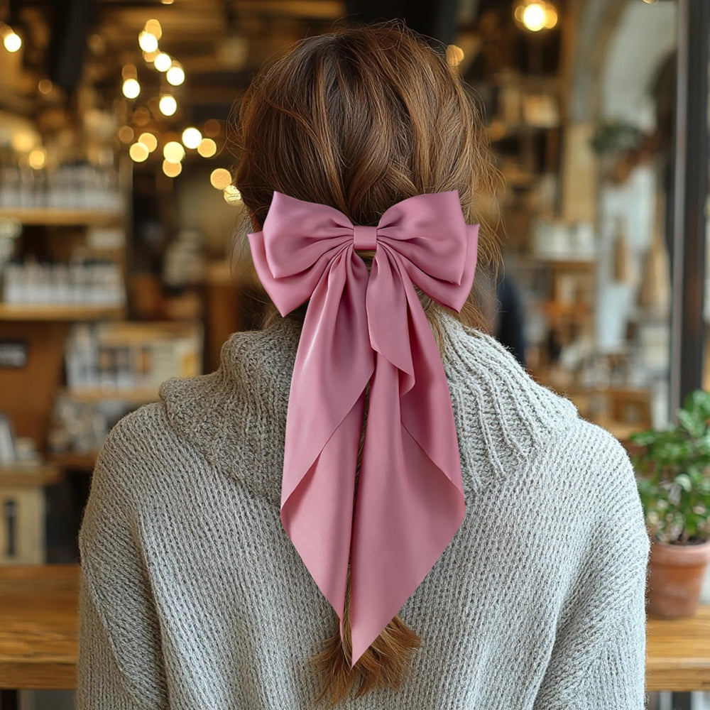 hisial red bow half-up hairstyle shows visible statement accessory