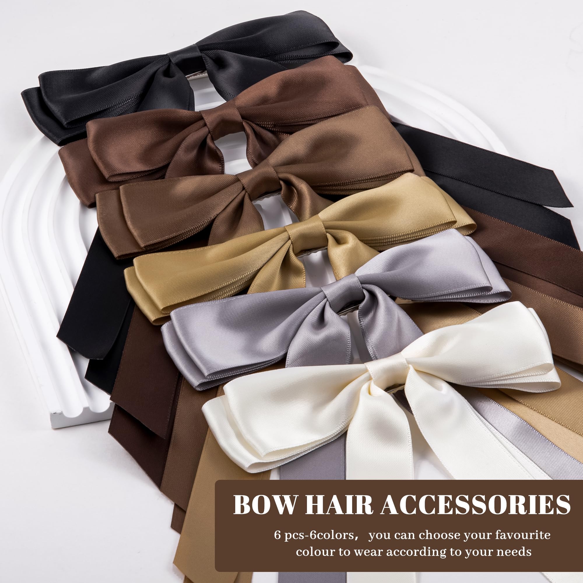 hisial bow beside a hand for scale showing compact size and easy wearability