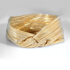 Hisight gold headband worn with low bun, adds polished evening benefit