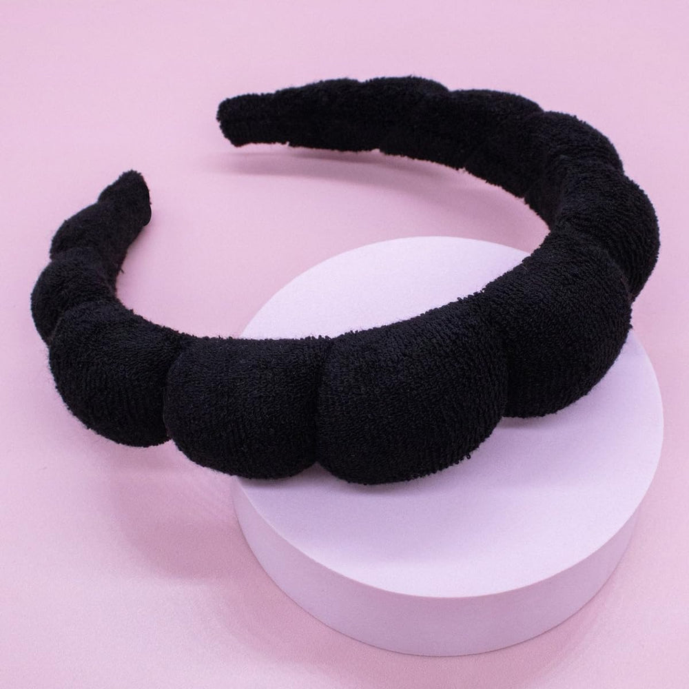 HitModa assortment of colored headbands styled on a vanity offering gift-ready options