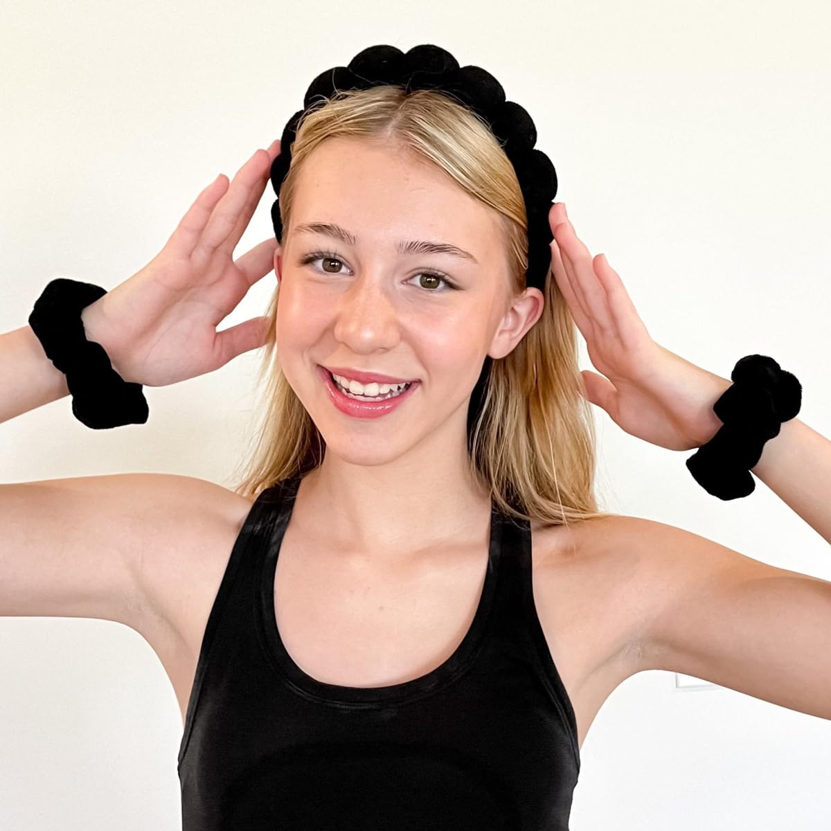 HitModa headband next to hand to show size and cushioned fit for adults and kids