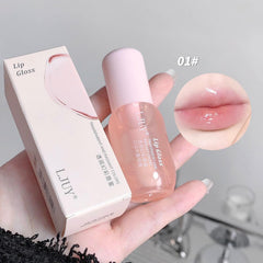 HJXUQIME lip oil stick applied on lips demonstrating hydrated, glossy look