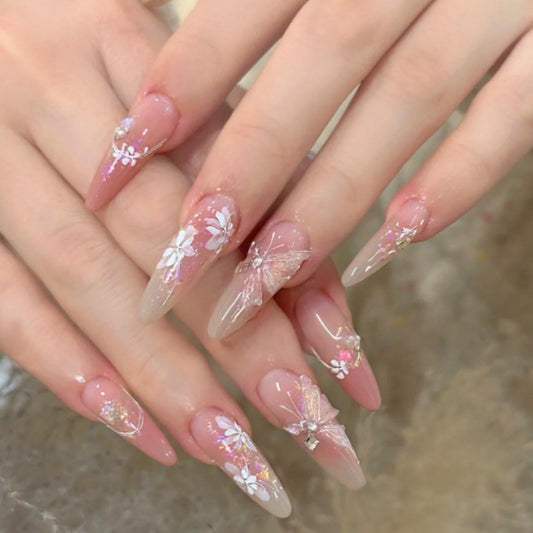 Hkanlre front packaging showing 24-piece pink butterfly nails and included tools benefit quick setup