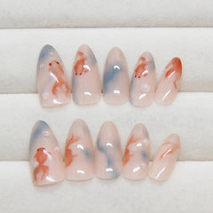 Hkanlre model hand wearing blue almond nails, quick salon-style look