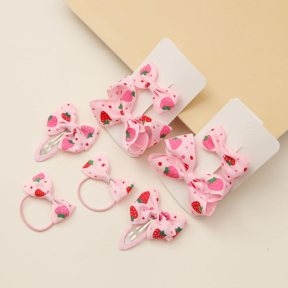 HLTOO young girl wearing strawberry clips and ties, adds cheerful style