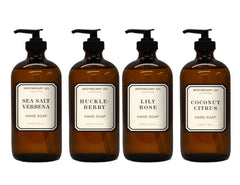 Home & Body Company front view of four amber glass soap bottles showcasing variety and style