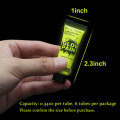 HomeHere tubes beside a coin for scale showing compact size benefit travel convenience