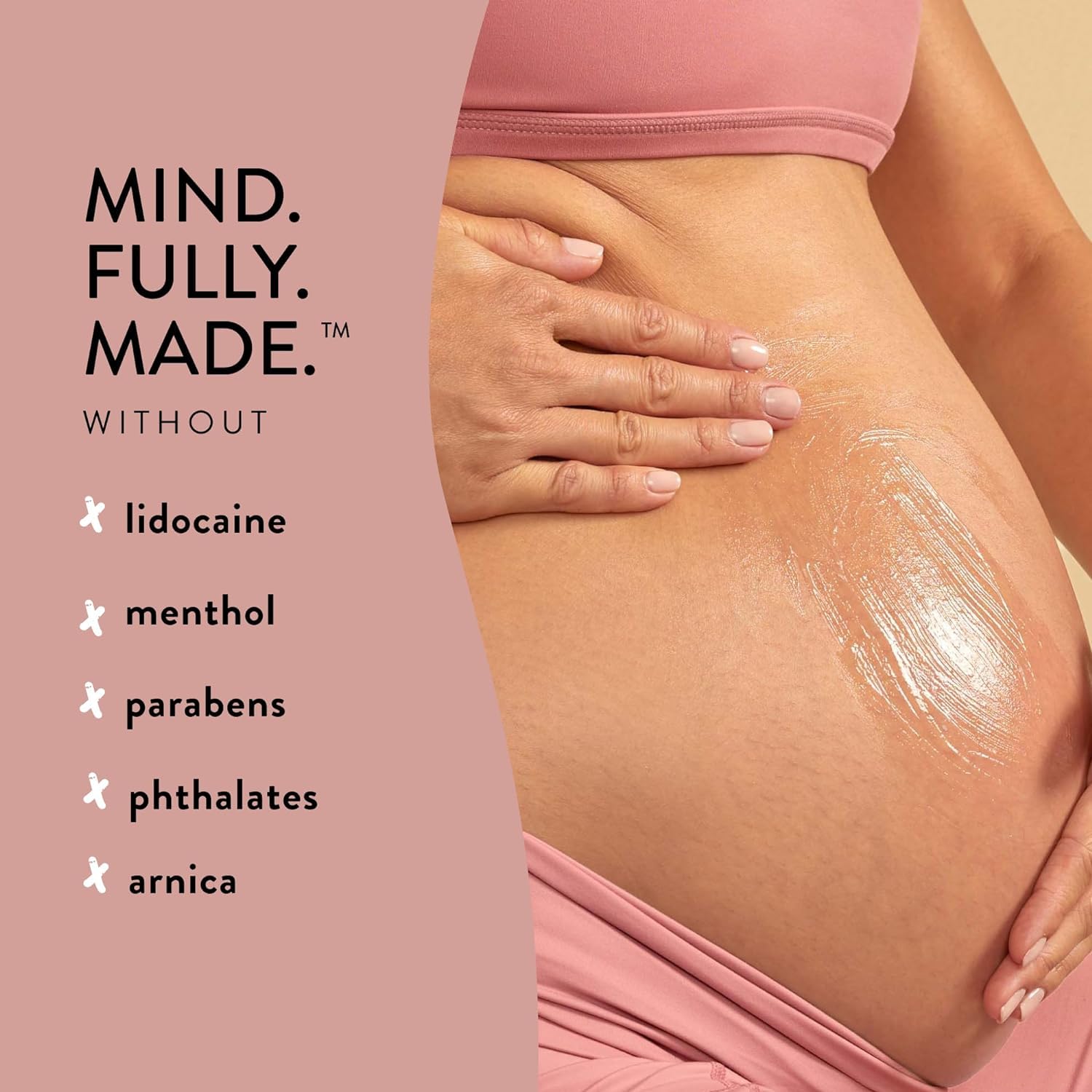 The Honest Company 4 fl oz bottle next to hand to show true size and convenience