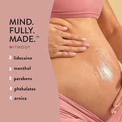 The Honest Company 4 fl oz bottle next to hand to show true size and convenience