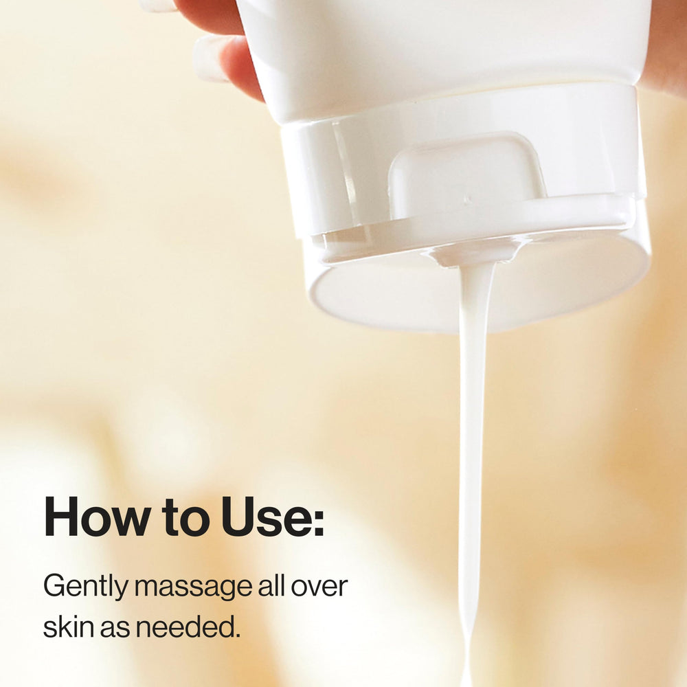 Size comparison of The Honest Company 8.5 fl oz bottle in an adult hand showing scale