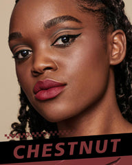 HOOMUSS chestnut on lips demonstrating smooth matte finish