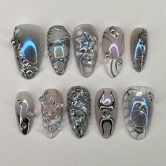 HPYFOI front packaging showing silver chrome press-on nails and included kit benefits