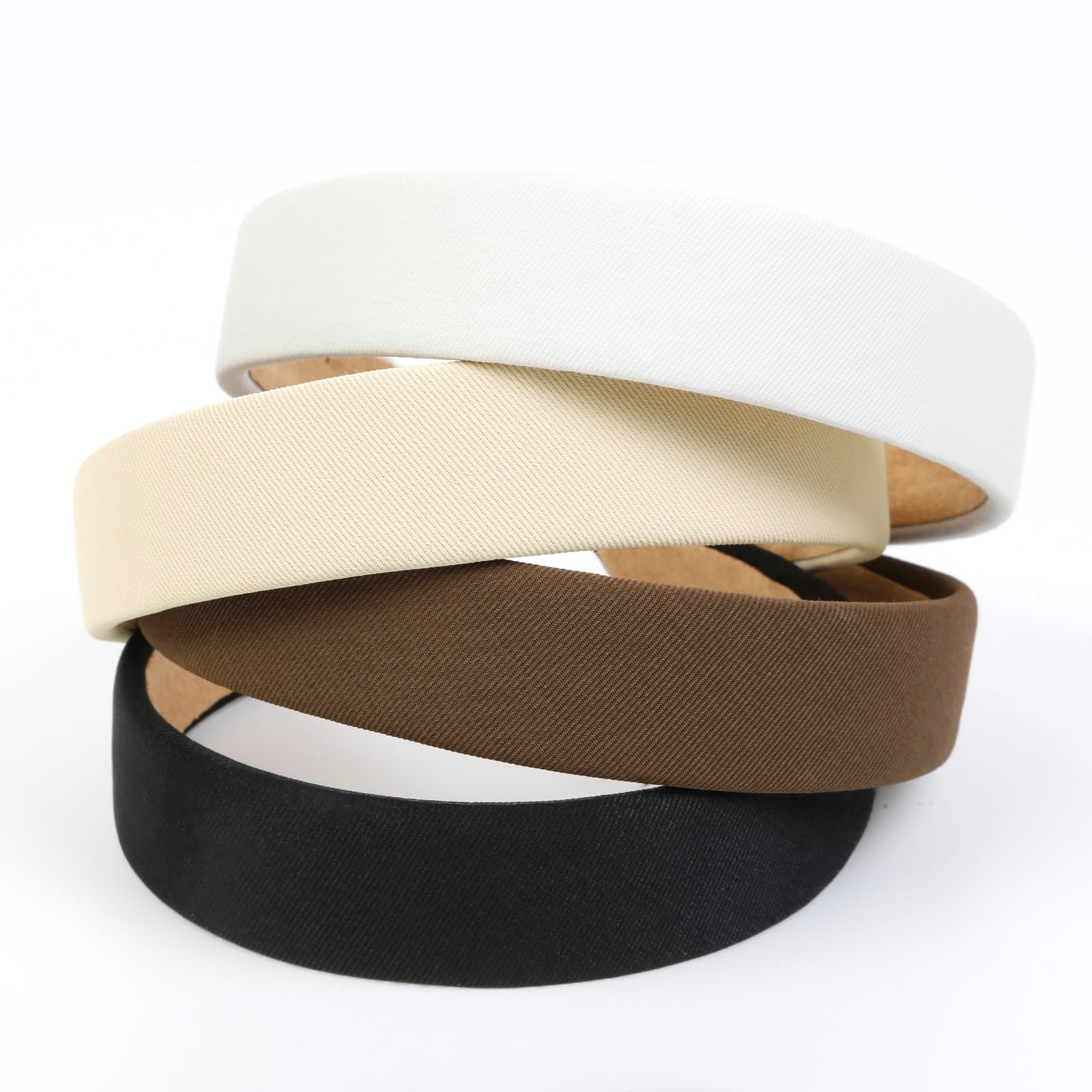 Huachi flatlay of black white beige brown headbands, coordinates with outfits