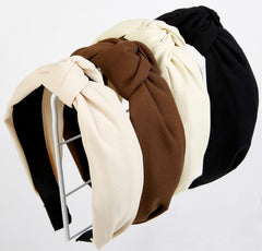 Huachi front view of four knotted headbands showing color variety and easy styling benefit