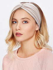 Huachi headband held in hand for size comparison showing one-size-fits-most convenience