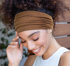 Huachi headband worn during yoga demonstrating secure non-slip hold