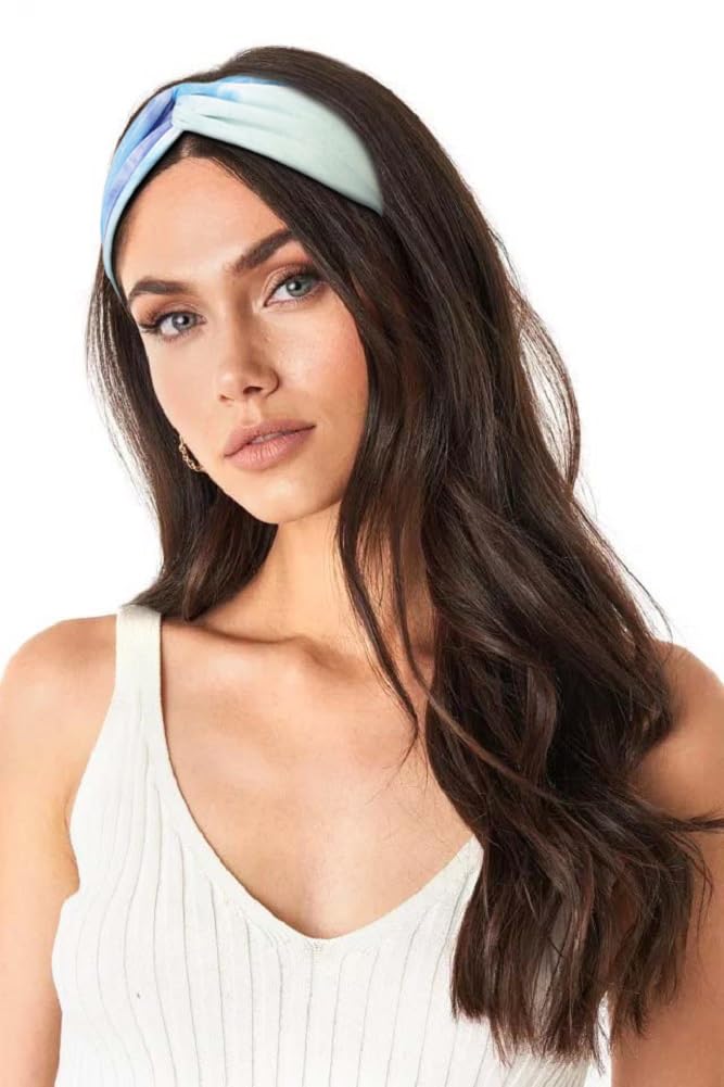 Huachi headband worn by woman at beach showing secure fit and sun-ready style