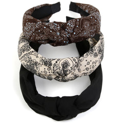 Huachi headband beside hand shows size and easy portability benefit