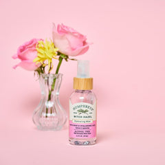 Humphreys travel size bottle beside passport for TSA-friendly convenience