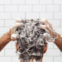 Huron conditioner staged in bathroom offering fresh citrus scent benefit