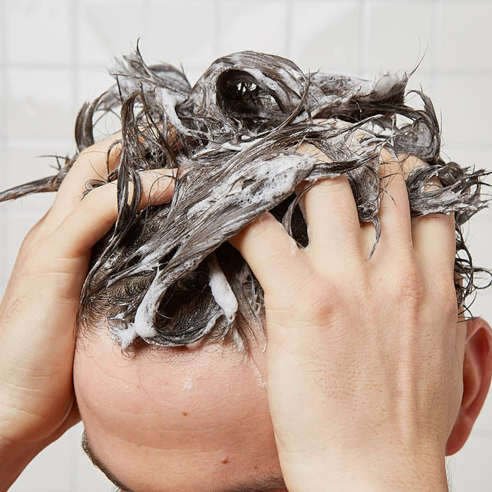 Huron in shower scene illustrating everyday use and fresh scent