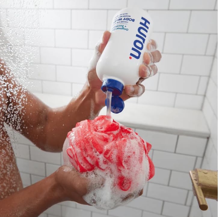 Huron in-shower lifestyle use showing refreshed post-workout benefit