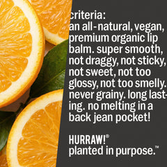 Hurraw! tube beside coin illustrating compact size for easy pocket carry