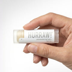 Hurraw! unscented next to coin for size comparison, compact for pockets and purses