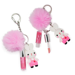iBi Makeup gloss in hand to show compact size and portability