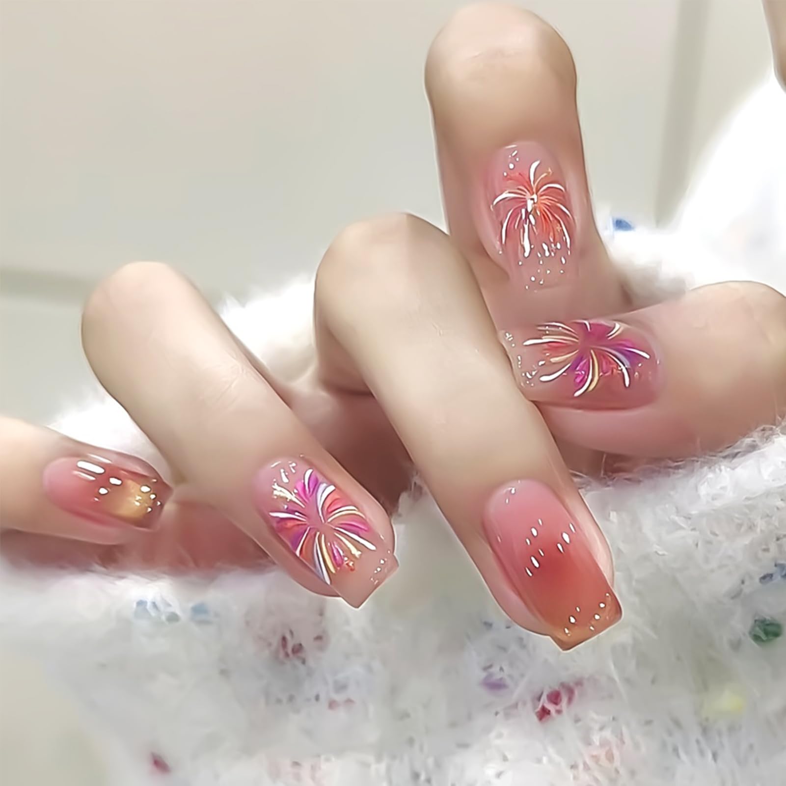 IDDFEVE lifestyle image of party manicure featuring glitter fireworks for celebration-ready nails