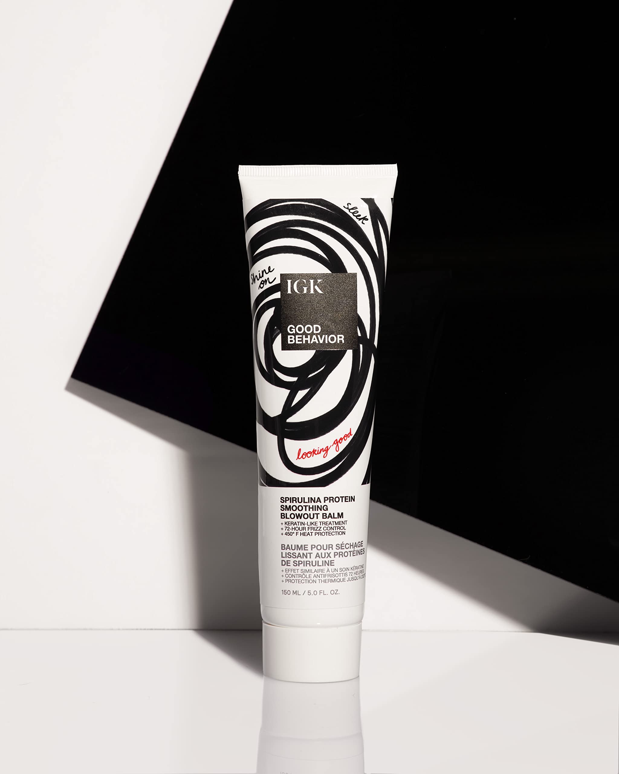IGK product applied to damp hair mid-lengths, demonstrates frizz control benefit