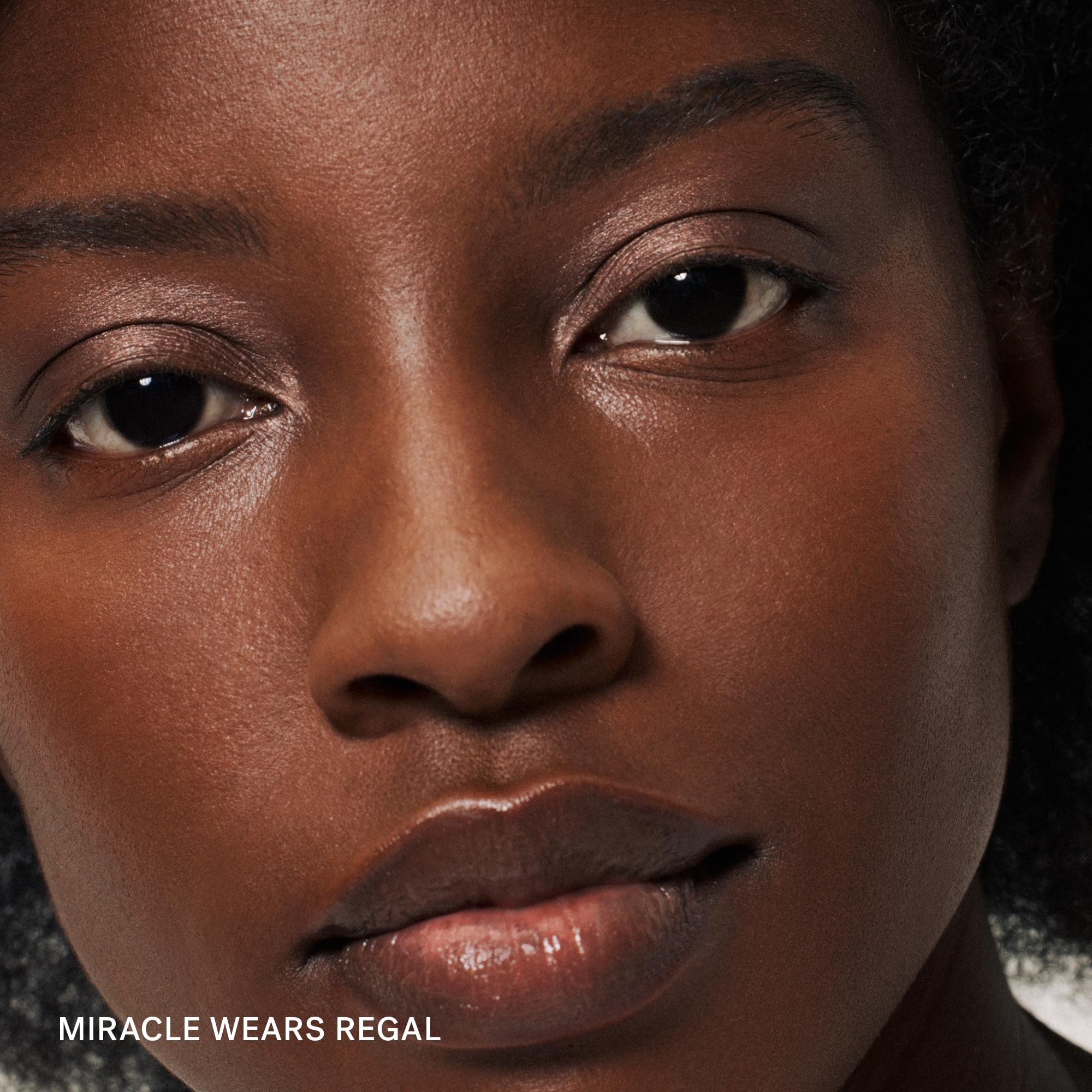 ILIA texture swipe of Regal shade on skin showing creamy shimmer payoff