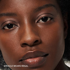 ILIA texture swipe of Regal shade on skin showing creamy shimmer payoff