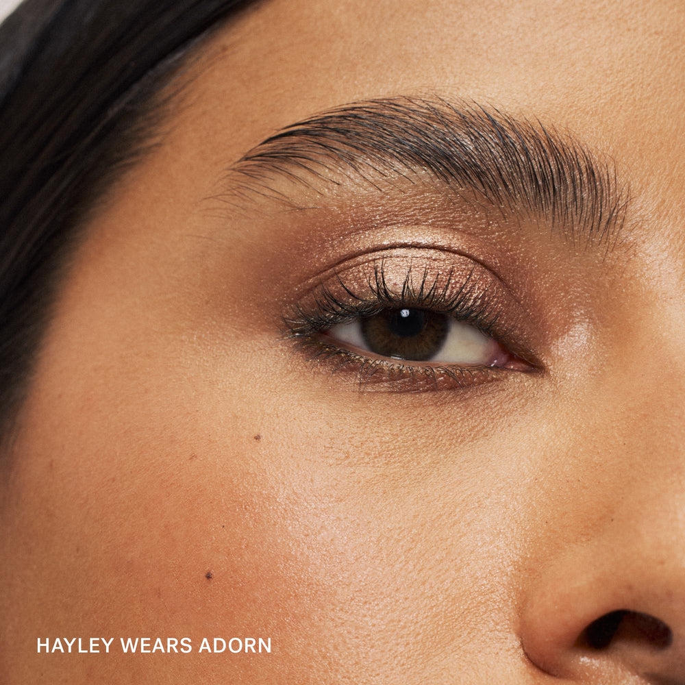 ILIA eye stylus texture swatch on skin showing creamy shimmer payoff