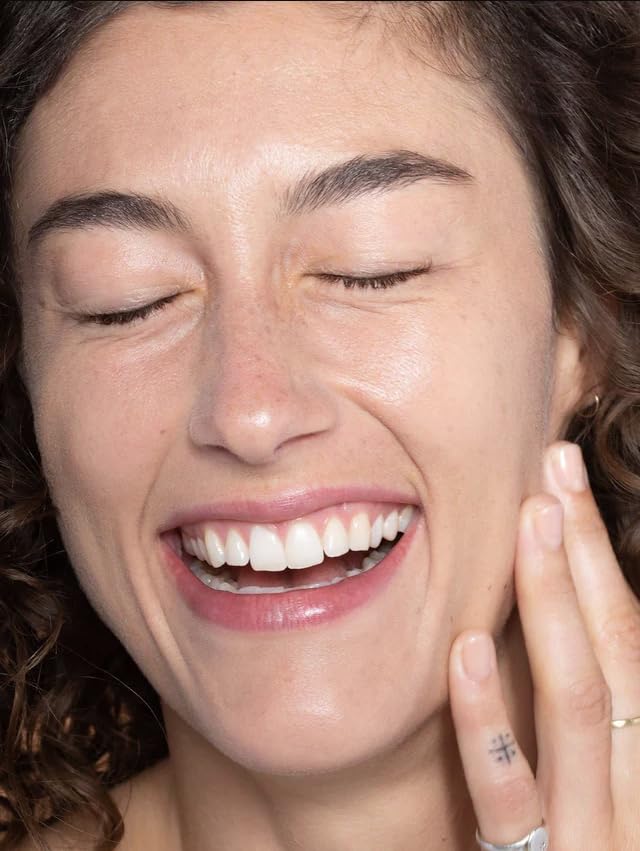 ILIA blended with brush showing easy application and natural finish