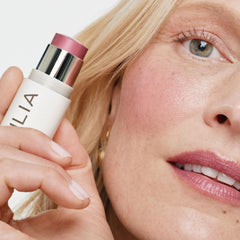 ILIA application on cheek giving a natural luminous finish