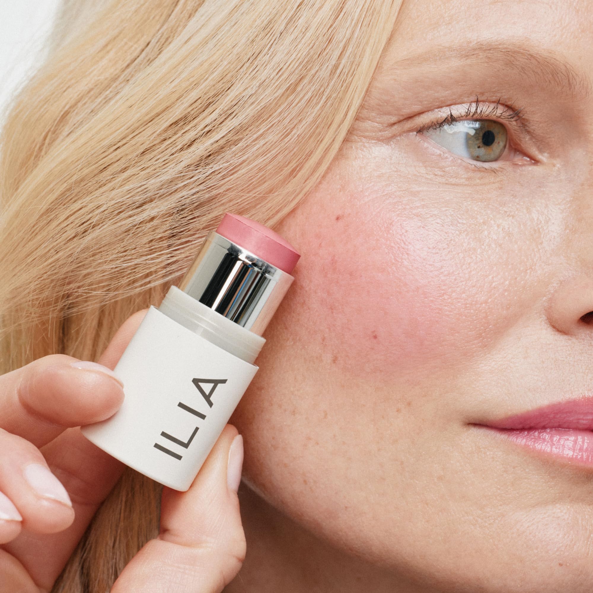ILIA closeup of Tenderly on lips showing soft pink tint and hydration