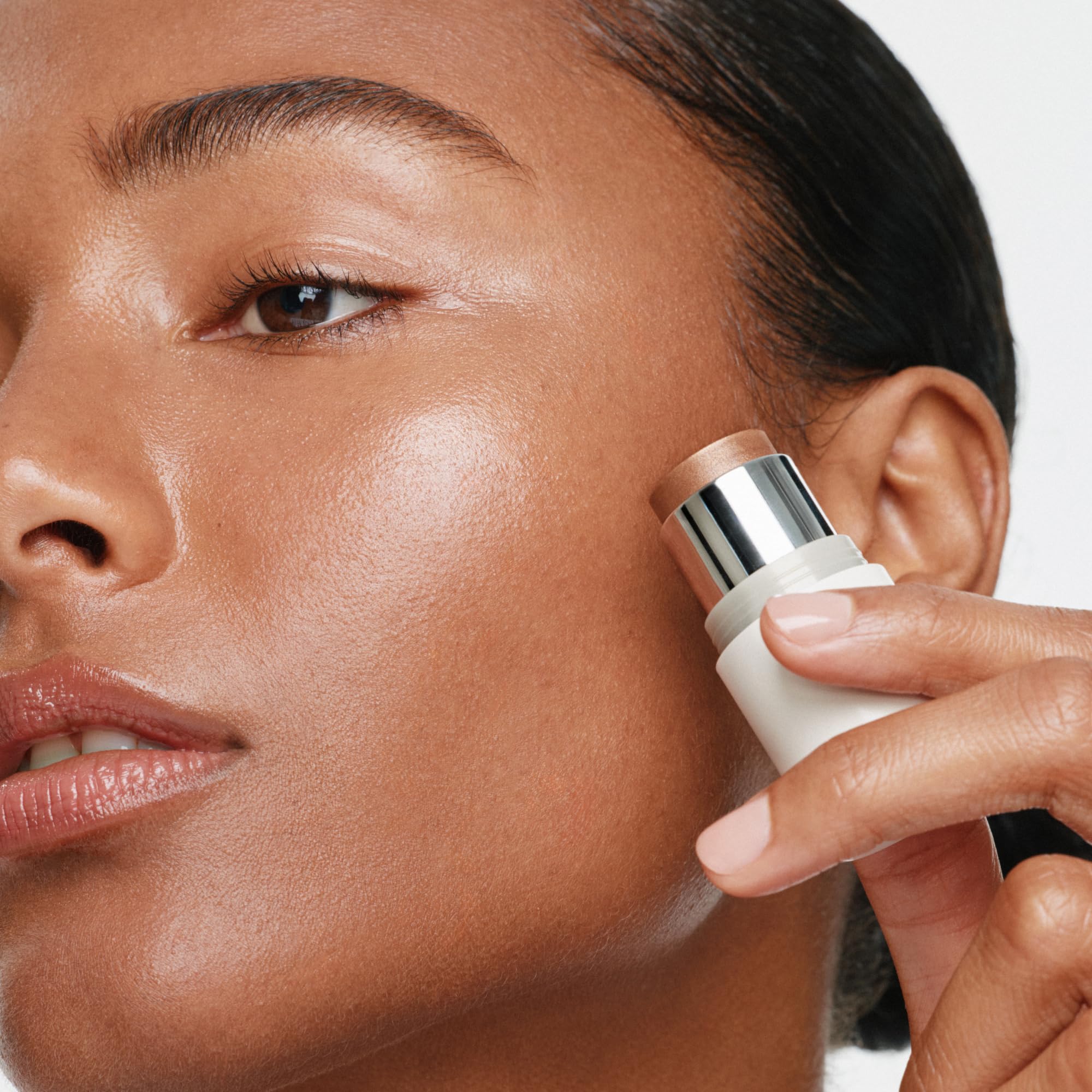ILIA multi-stick applied on lips illustrating hydrating color and natural sheen