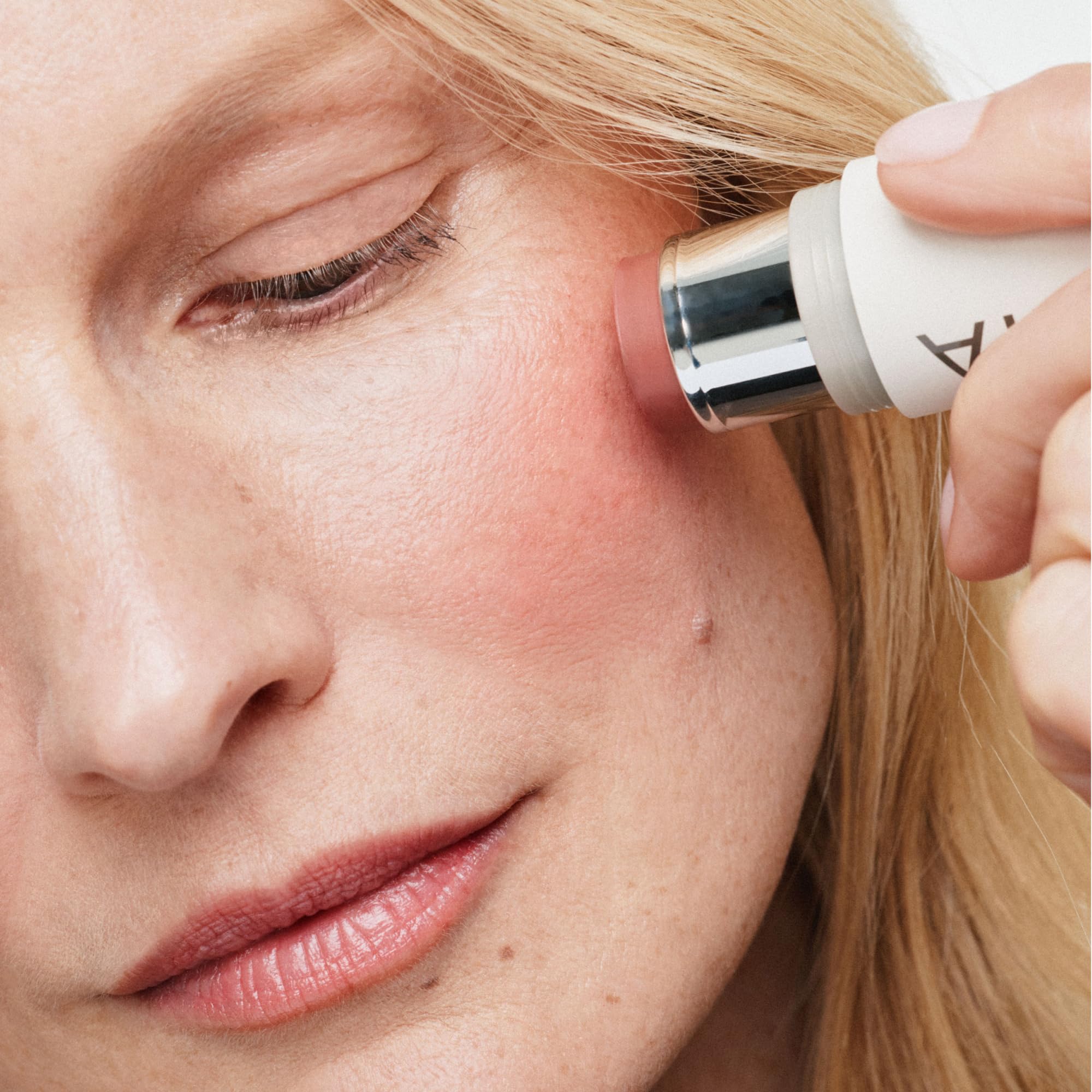 ILIA multi-stick applied on lips showing hydrated tint benefit