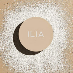 ILIA jar on vanity in styled bathroom suggesting clean-beauty routine and everyday use