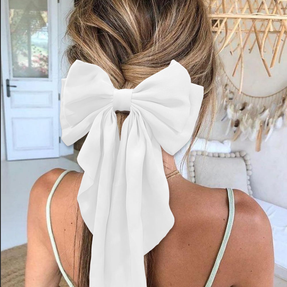 illpta bow in ponytail demonstrating volume and easy everyday styling